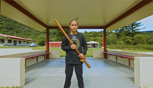 Maire Kennedy (Ngāti Pikiao) at Lake Rotoiti.